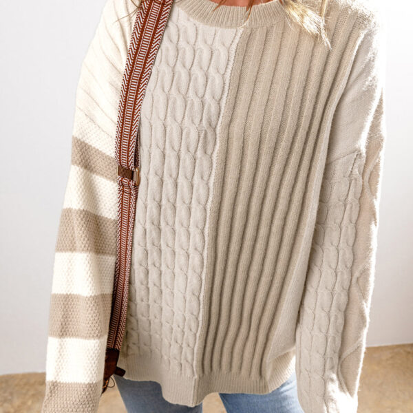  This comfy sweater features a timeless cable knit design for a cozy and textured appearance. Its classic crew neck style is perfect for looking both chic and versatile. With its long sleeves