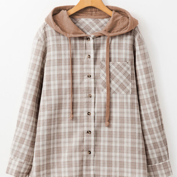  The shacket showcases a blend of classic design and a loose