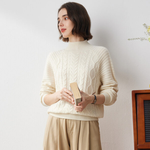 Embrace cozy sophistication with our Elegant Cable Knit Turtleneck Sweater. Crafted from premium