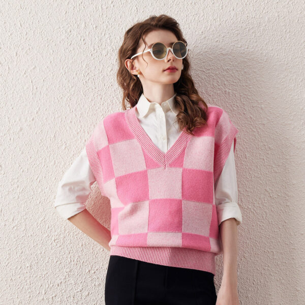 Make a bold fashion statement with our Pink Checkered Knit Vest. This trendy vest features a striking pink and white checkered pattern