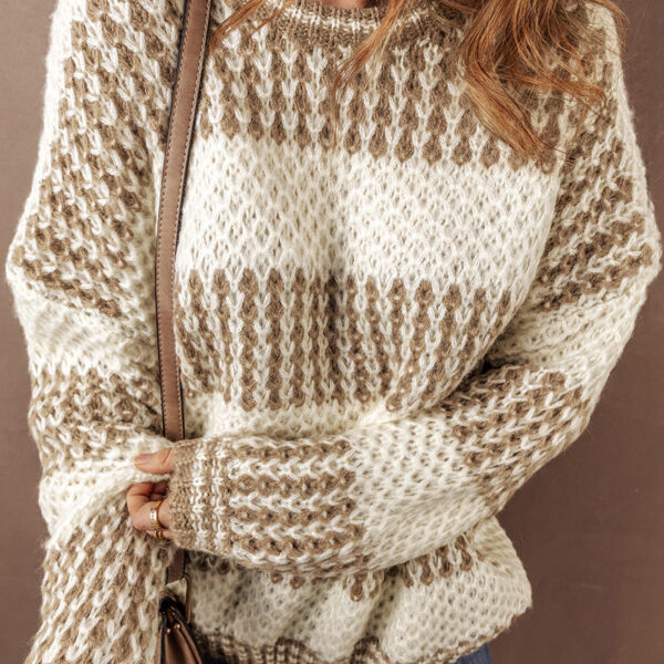This fashion sweater is effortlessly stylish with a drop shoulder design.Chic striped pattern adds a fashionable flair.Comfortably loose fit for a casual slouchy look.Trendy round neck for a modern touch.