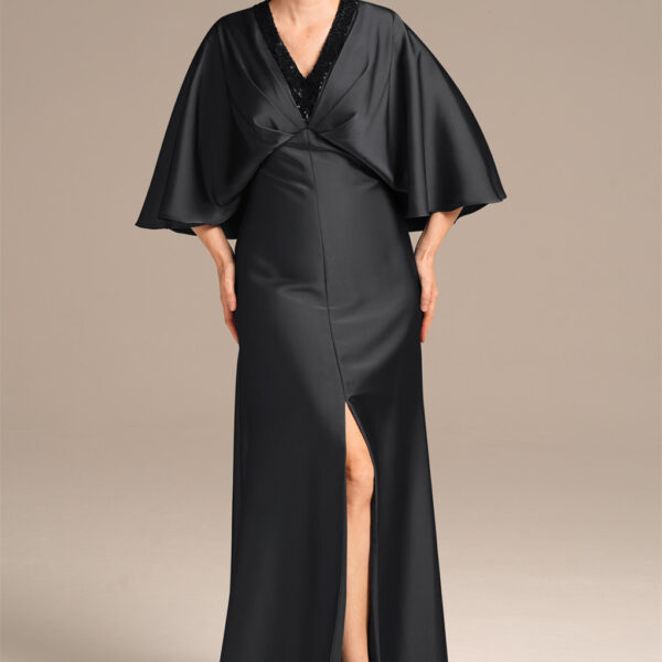 sweeping the floor and framed by an exquisite v-neck.