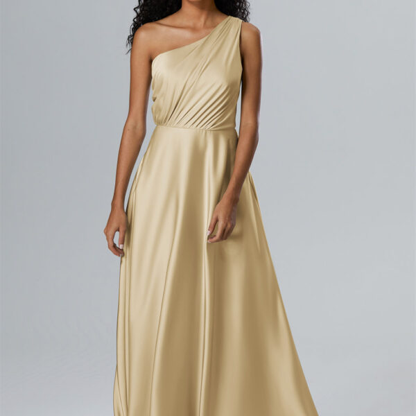 designed with an elegant asymmetrical neckline and a gentle A-line sweep that graces the floor with each step. Get the Perfect Bridesmaid Glam!