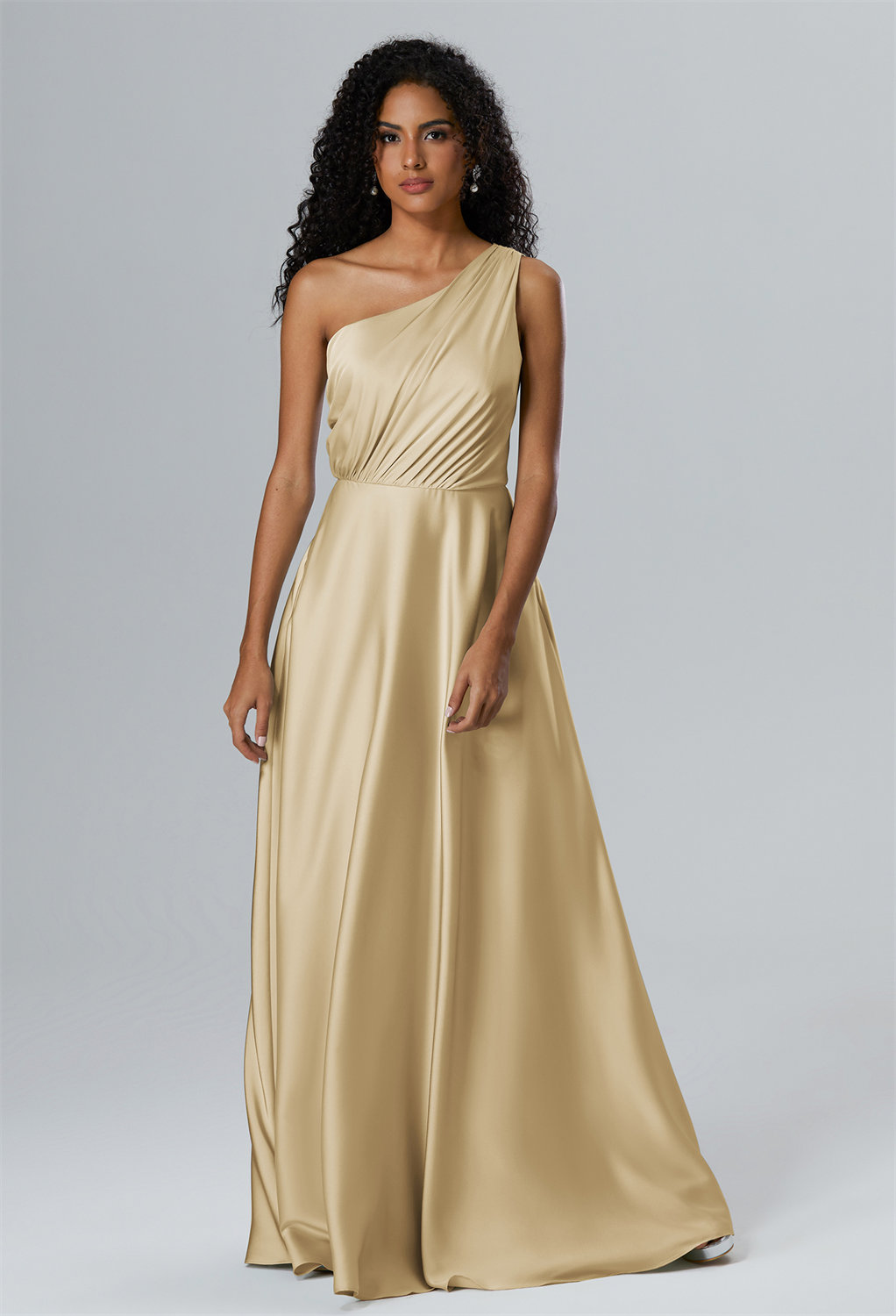 designed with an elegant asymmetrical neckline and a gentle A-line sweep that graces the floor with each step. Get the Perfect Bridesmaid Glam!