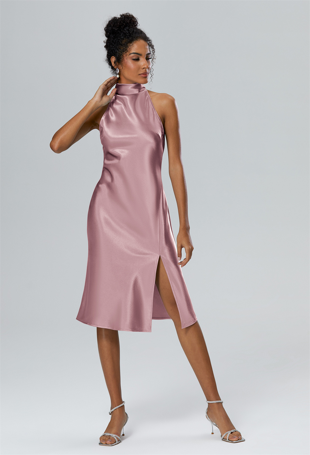 The Mujigea Dress features a delicate and flowing A-line silhouette that is both flattering and comfortable to wear.The halter  neckline and illusion back add a touch of allure and elegance to the overall design.