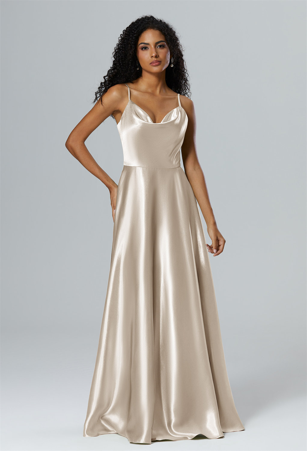 this floor-length dress casts a stunning silhouette with its A-line design. The asymmetrical neckline adds a distinctive flair