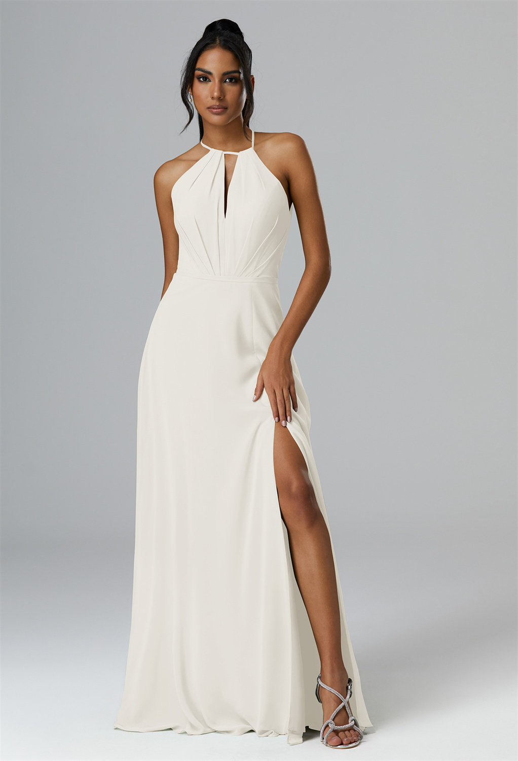 cut with an elegant jewel neckline and a graceful A-line silhouette.