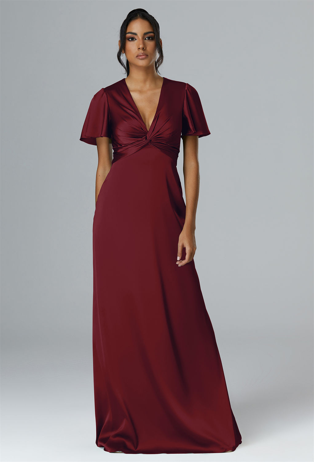 this floor-length A-line dress combines a V-neck design with effortless grace for a ceremonial spectacle.