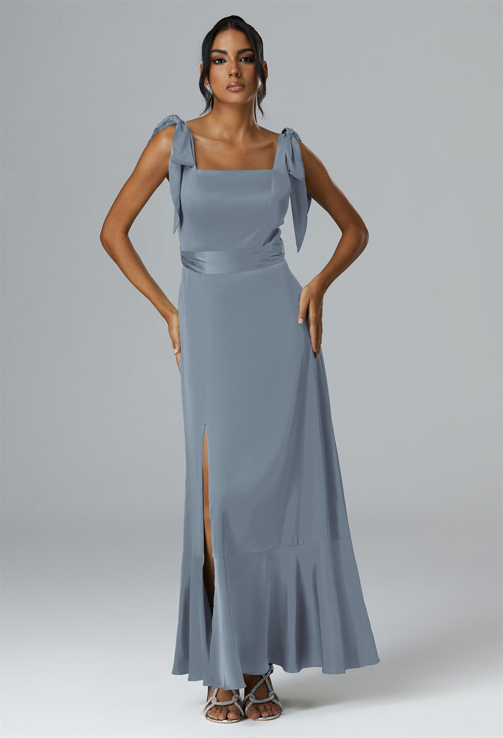 crafting a canvas of pure elegance for a bridesmaid's poised appearance.