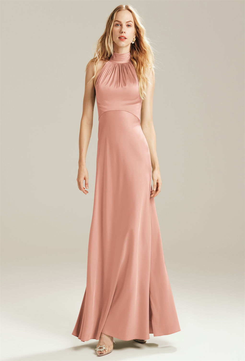 The Janina bridesmaid dress offers a flattering halter neckline that makes it simply perfect for a spring or summer wedding. Bared shoulders are a flirty choice that will make every bridesmaid shine. The satin charmeuse fabric is elegant and will assure y