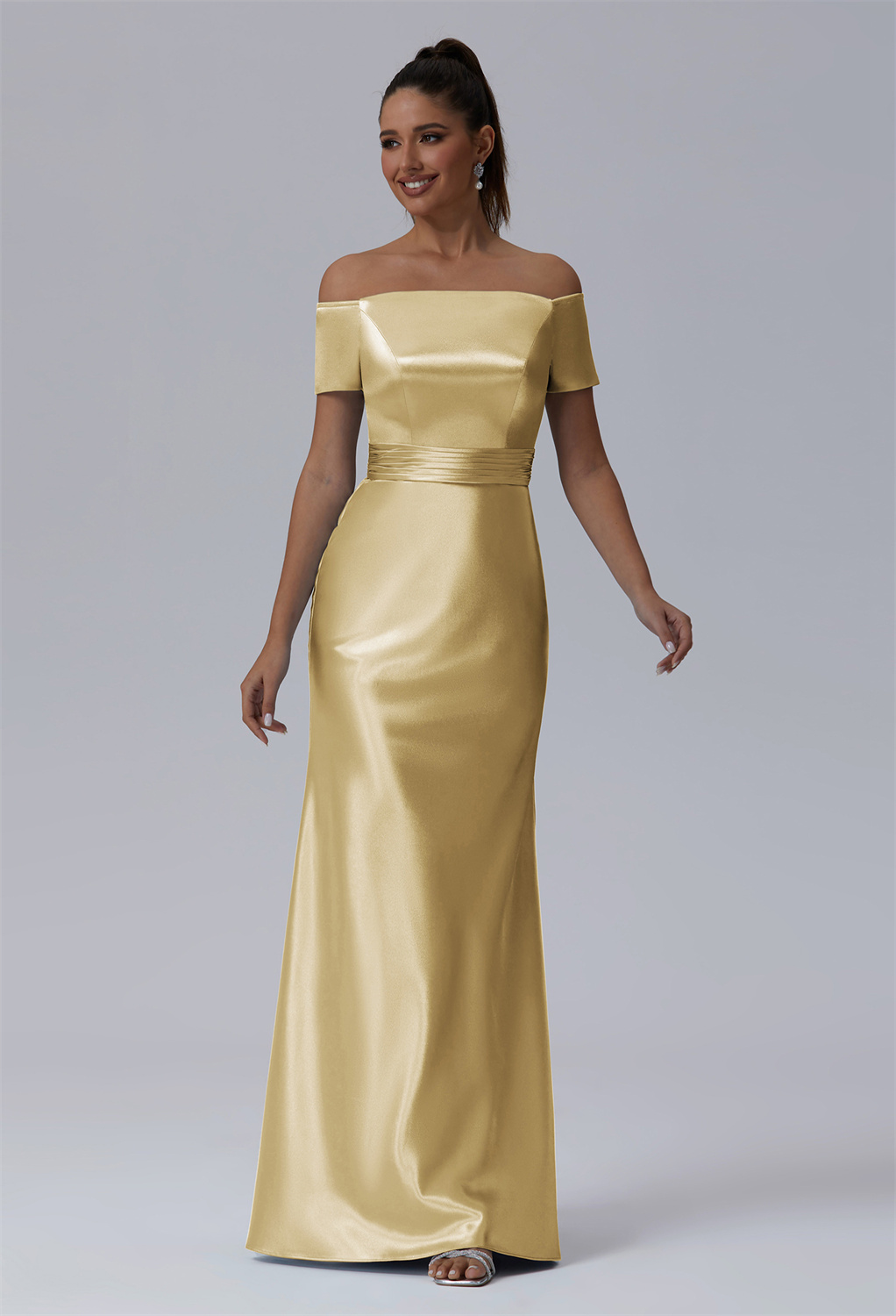 cut in a mermaid silhouette that contours every curve gracefully. The silky