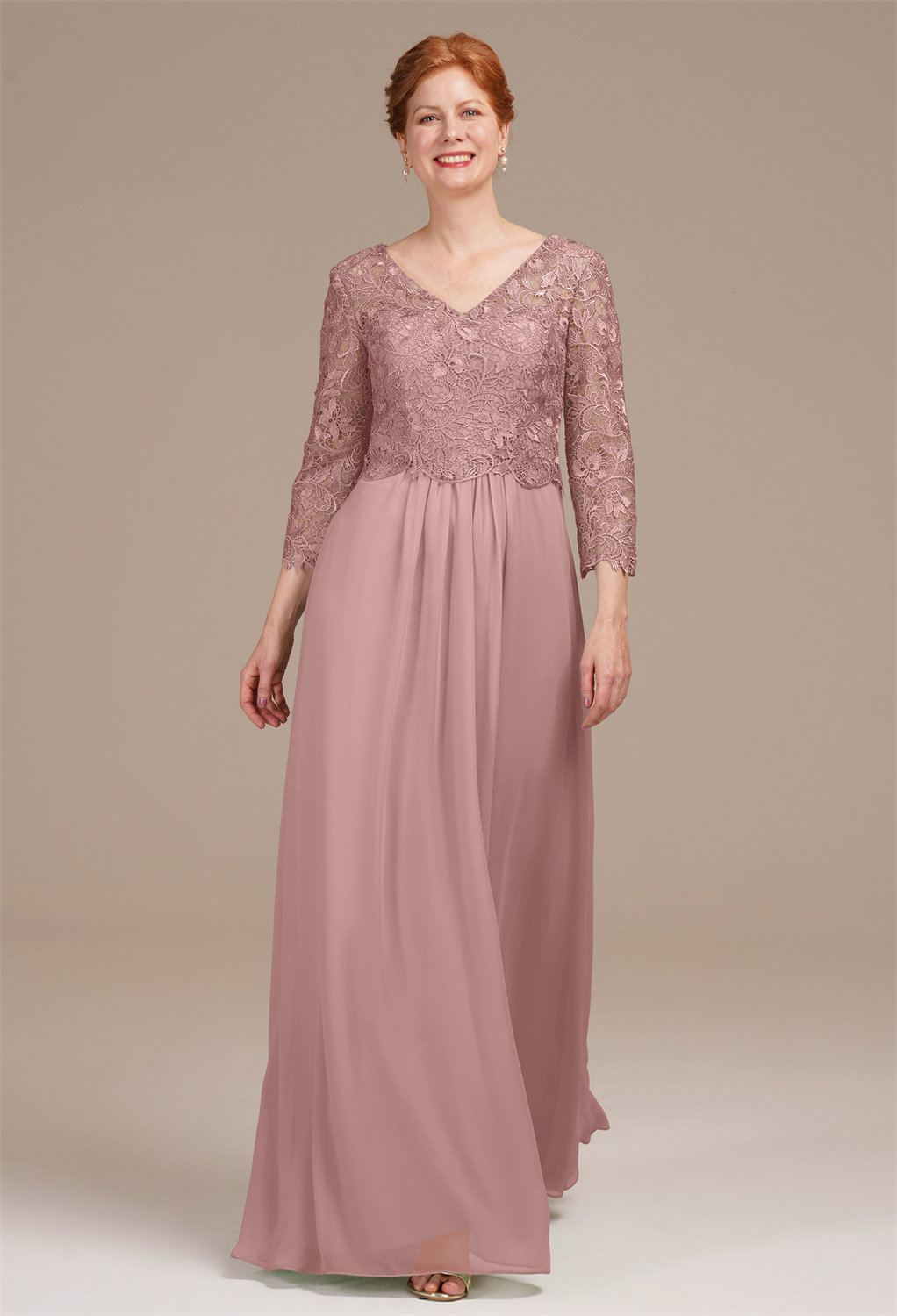 this dress showcases a tasteful V-neck and 3/4 sleeves for a touch of sophistication. Applique accents enhance its charm