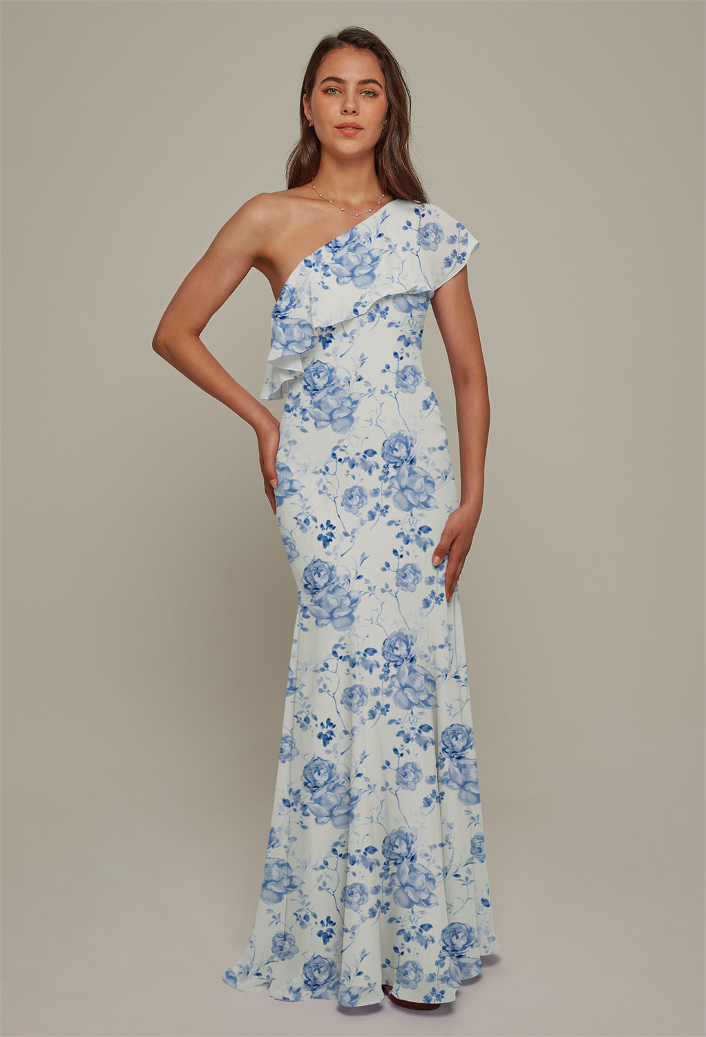 The Ion dress is a floor-length gown that offers a mermaid silhouette that you will fall in love with when you see yourself in the mirror. The curve hugging dress is charming and has a pretty ruffled embellishment. The dress boasts an asymmetrical necklin