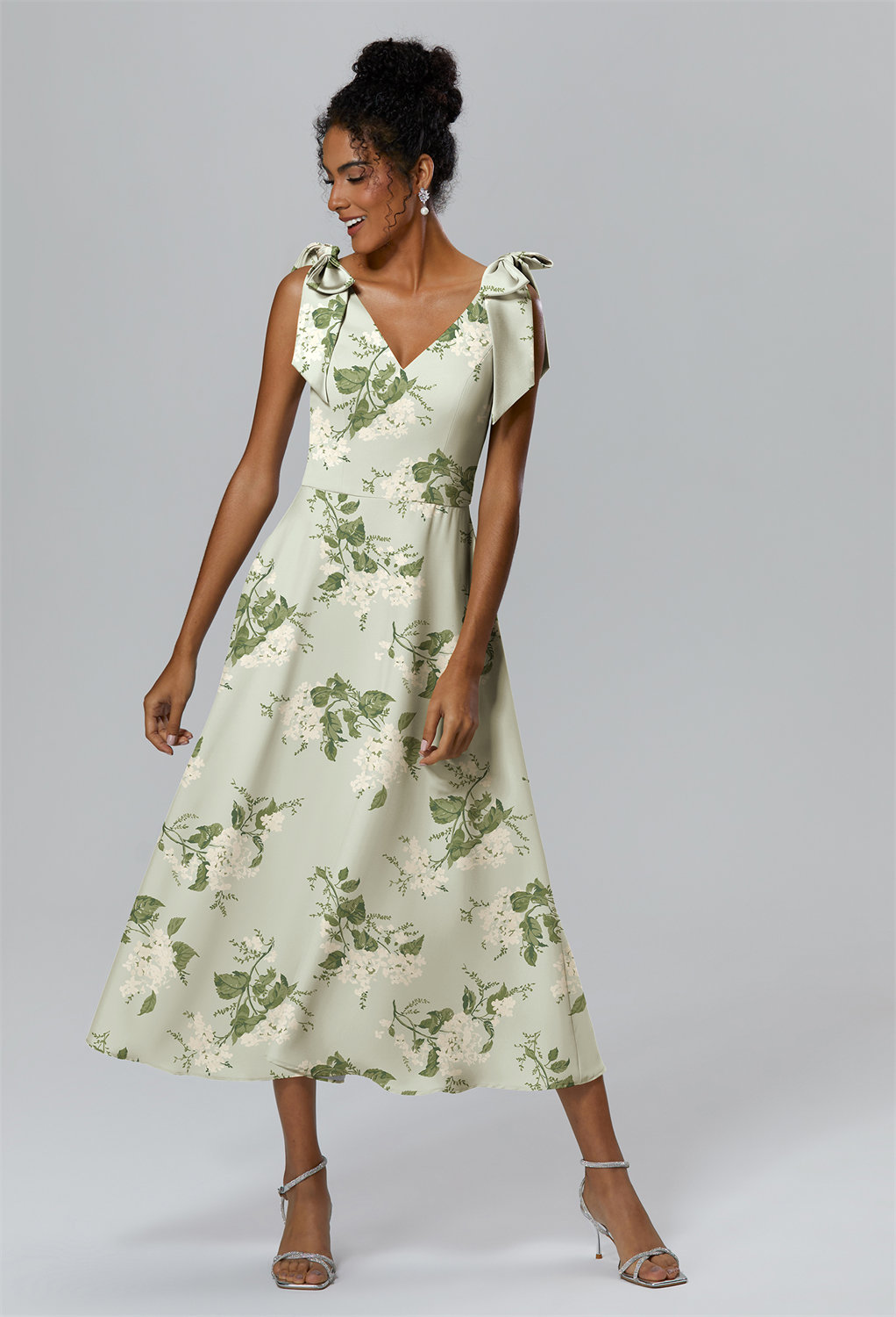 highlighting the effortless and feminine vibe to the dress.