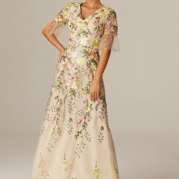 draping you in an A-line tulle canvas that cascades to the ankles