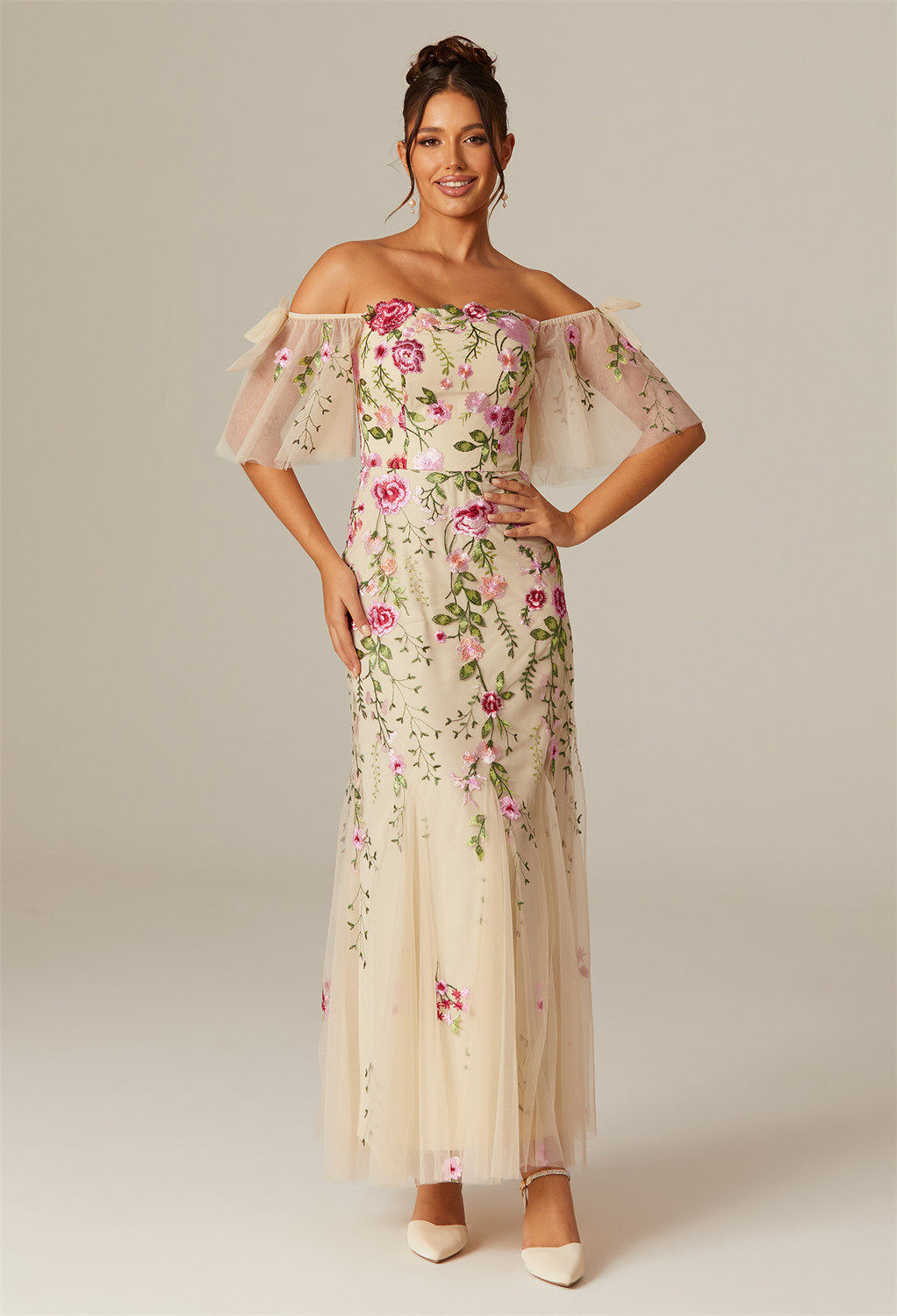 where delicate tulle hugs your form and blossoms at the ankle