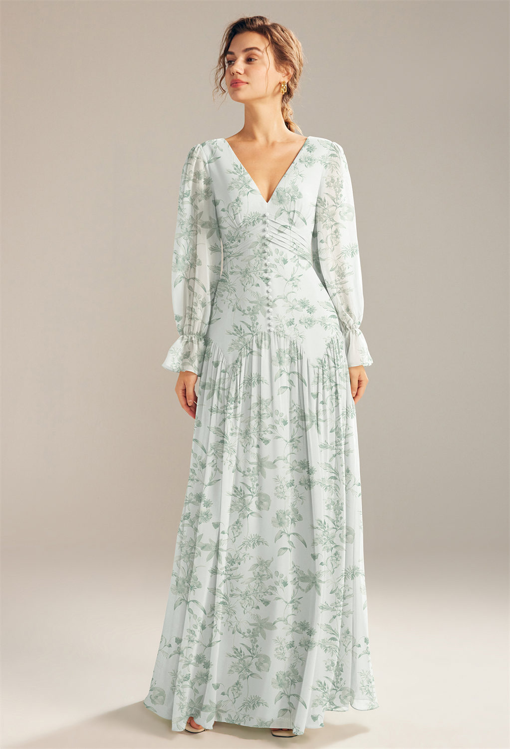 floor-length gown with transparent balloon sleeves for a graceful stride. Styled with an endearing v-neckline on both sides of the dress