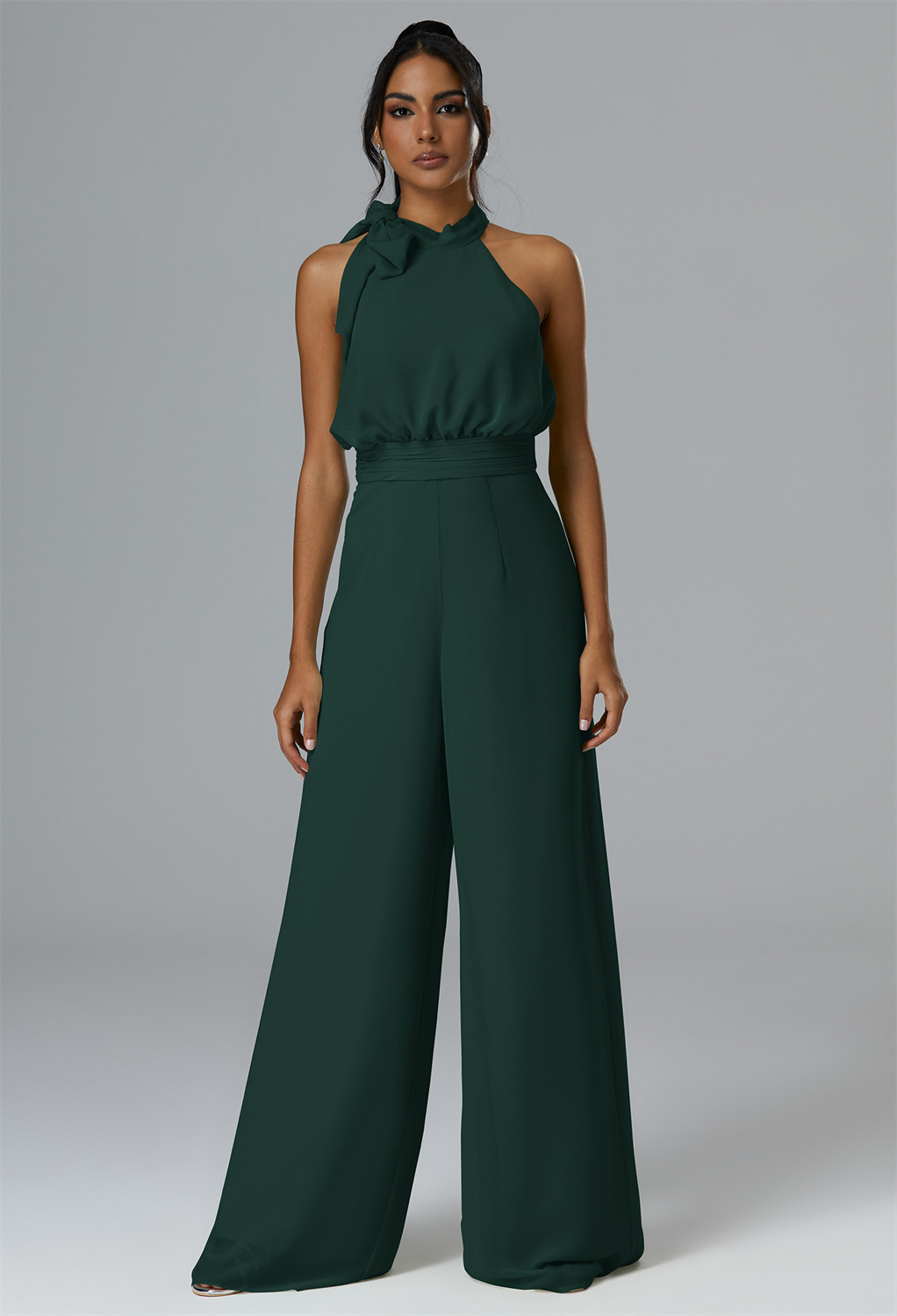 Drapey chiffon fabric adds flourish to the halter neckline of this floor-length jumpsuit designed with built in bras and a sleek straight-leg silhouette.