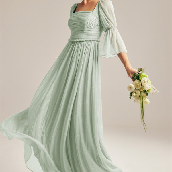 this square-neckline dress with moderately puffy shoulders and straight elbow-length arms is styled to provide a fine blend of the modern and classic look. It is a floor-length
