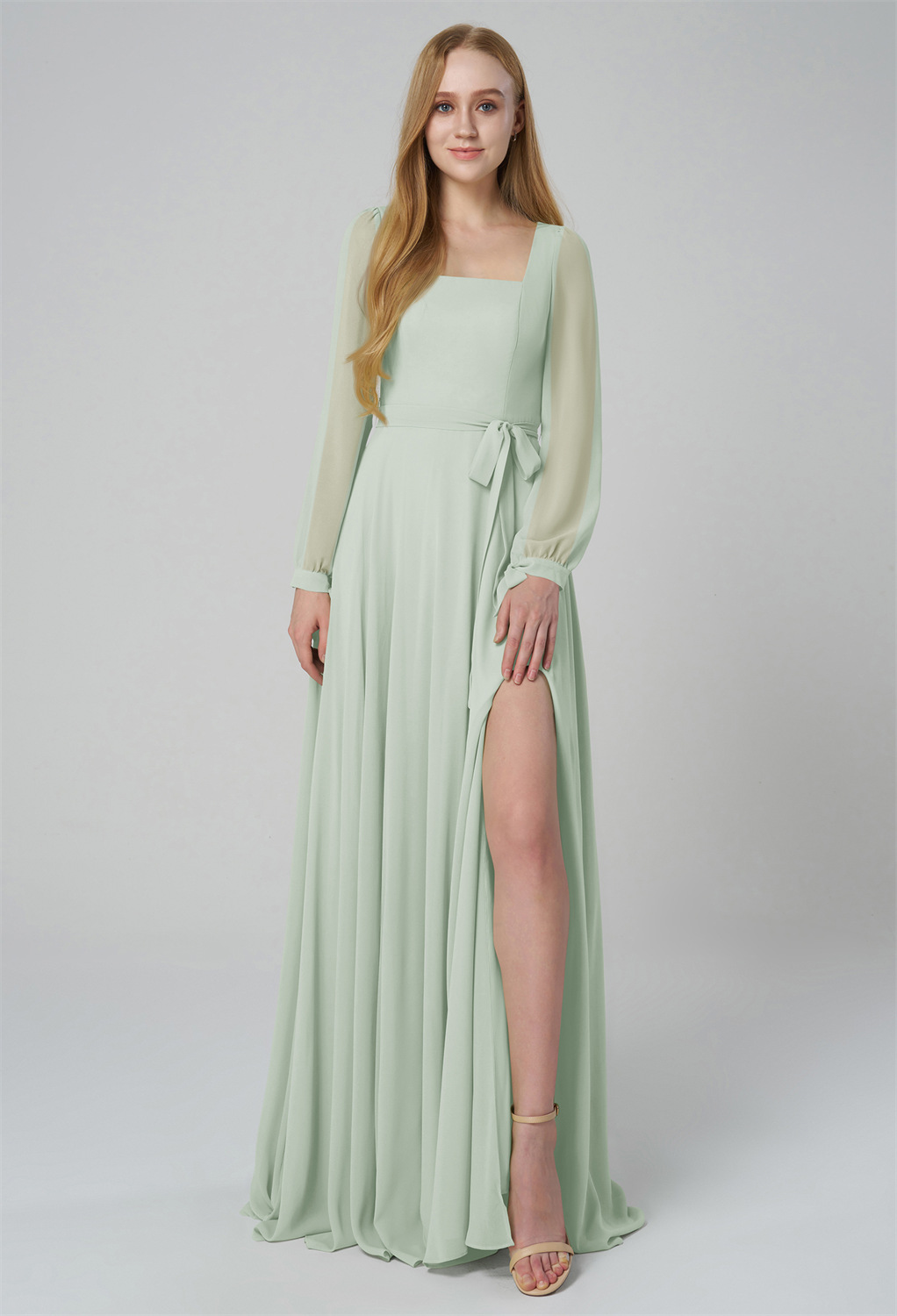 offering a timeless and graceful look. The flowing skirt is enhanced by a high slit