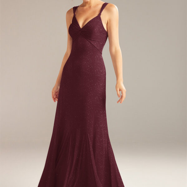 this dress is styled as a floor-length A-line gown with sleeveless sheer straps and v-neck line. Aw Brendas low open back lace-up design and back belt is pa