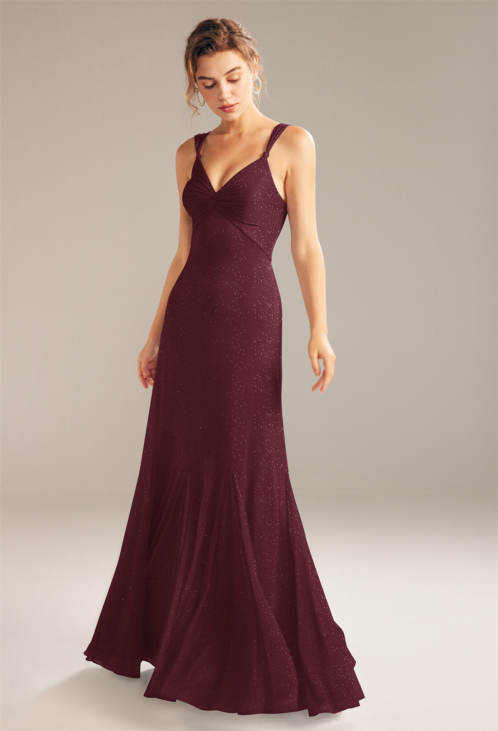 this dress is styled as a floor-length A-line gown with sleeveless sheer straps and v-neck line. Aw Brendas low open back lace-up design and back belt is pa