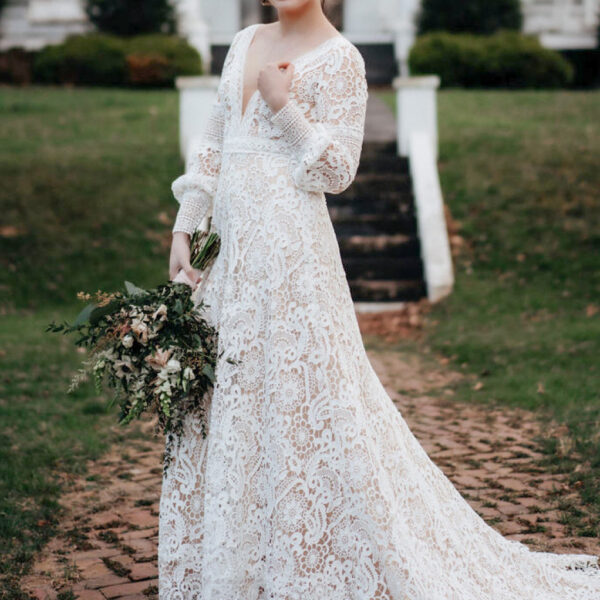 AW Regan Wedding Dress is a stylish lace fabric combining the simple strapless long sleeves and back zipper with a classy V-neck neckline and an A-line silhouette to give a striking outline. AW Regan Wedding Dress is a hot pick for a bride who admires a f