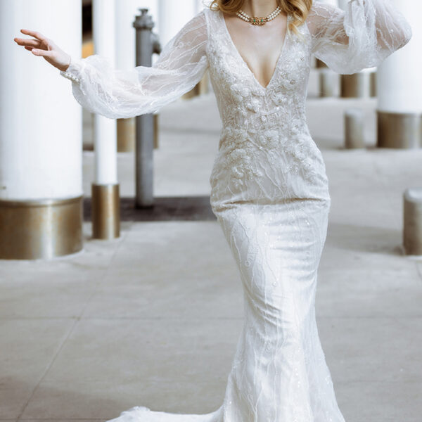 perfect for a bride who admires a simple mix of class and style. The floor-length mermaid silhouette gown is as simple as any wedding gown gets. It offers buttons as its back details