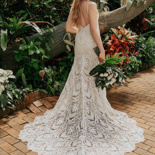 the lace dress has an elegant mermaid silhouette