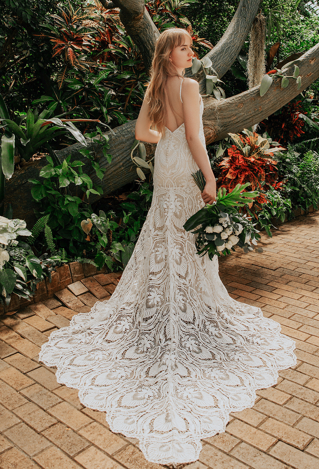 the lace dress has an elegant mermaid silhouette