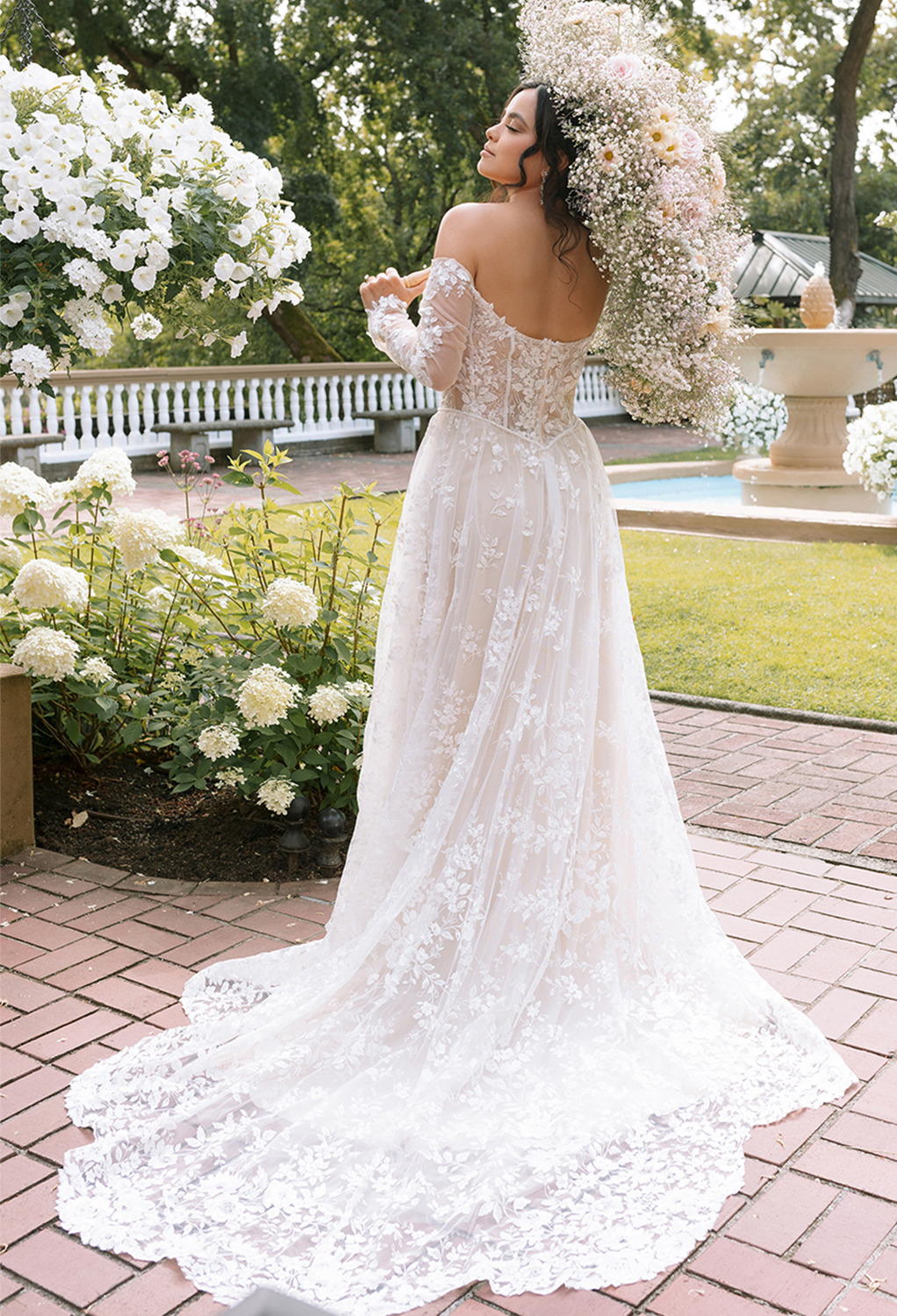 the strapless long-sleeved dress is lined with a built-in bra and is held in place by a bac