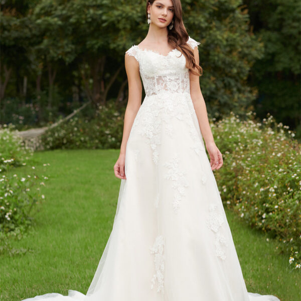 A-line bridal gown features a modest sweetheart neckline on a sleeveless bodice with built-in bra. The floral-like designs accent the jaw-droppingly gorgeous see-through b