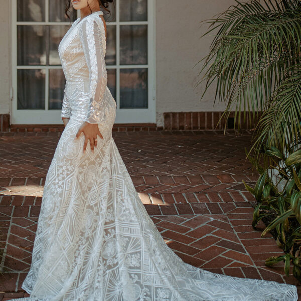 the Esther wedding dress is a darling choice for the bring looking for something that is a step into the past. The dress features long sleeves and a pretty lace embellishments that will add a hi