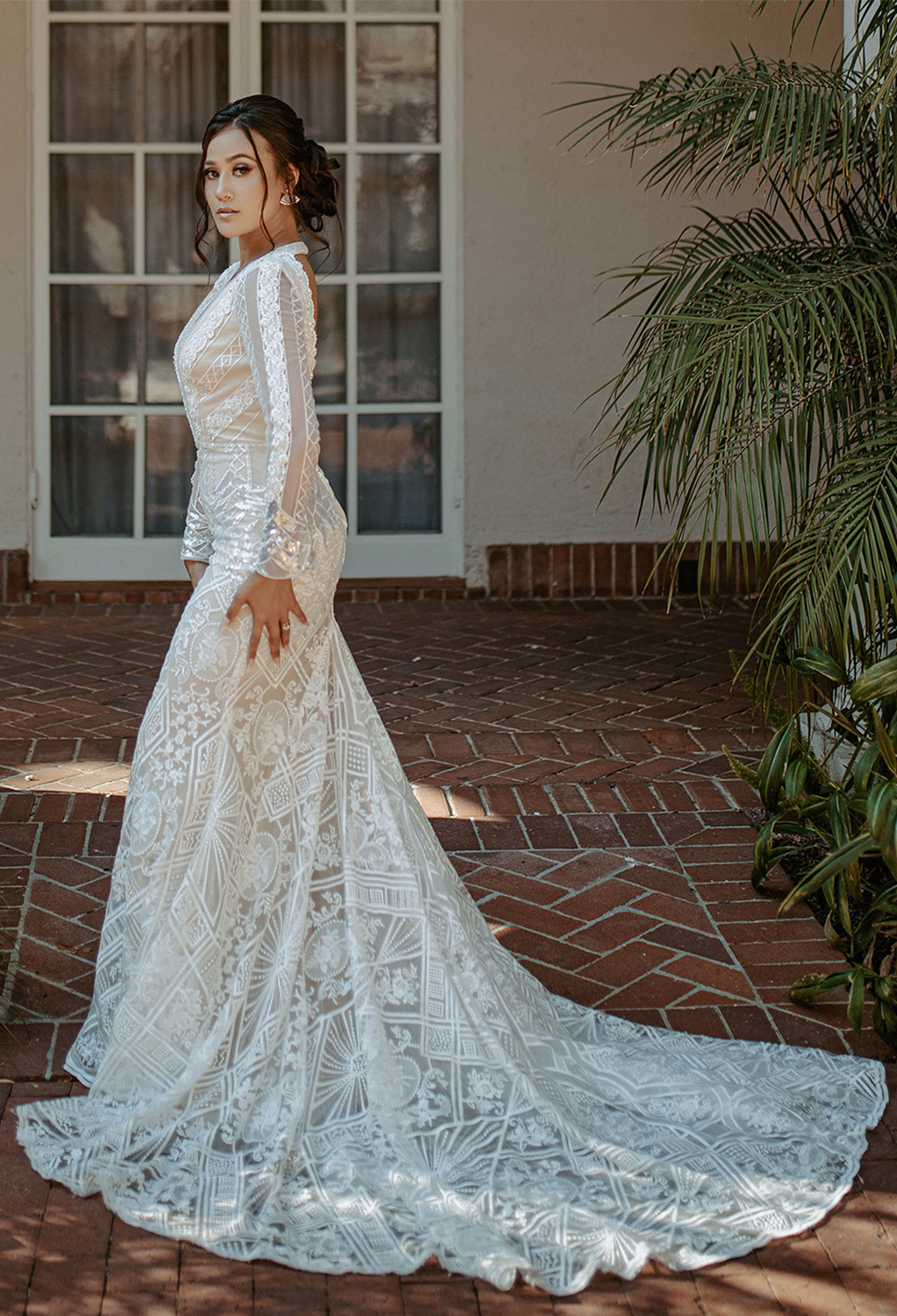 the Esther wedding dress is a darling choice for the bring looking for something that is a step into the past. The dress features long sleeves and a pretty lace embellishments that will add a hi
