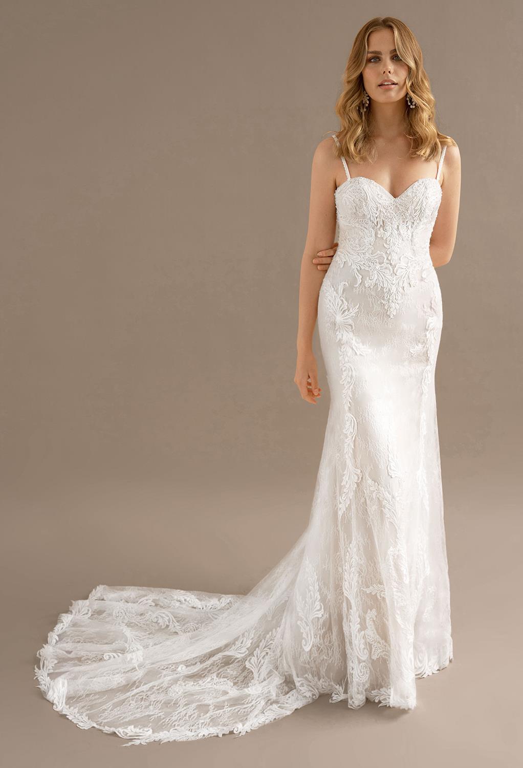 Dainty spaghetti straps and a flattering sweetheart neckline add a romantic charm to the Rosa wedding gown. The bared back of the gown is a flirty feature that you will completely adore. The almost sheer train features pretty applique embellishments and w