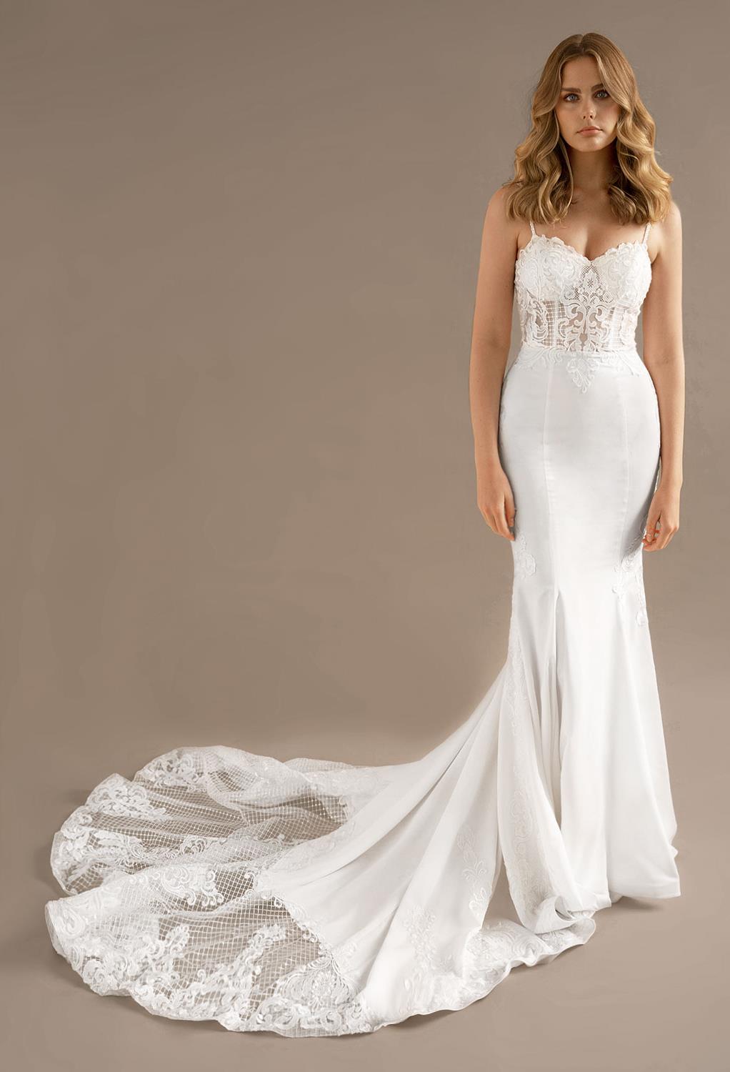 while the sweetheart bodice of the dress features pretty applique embell