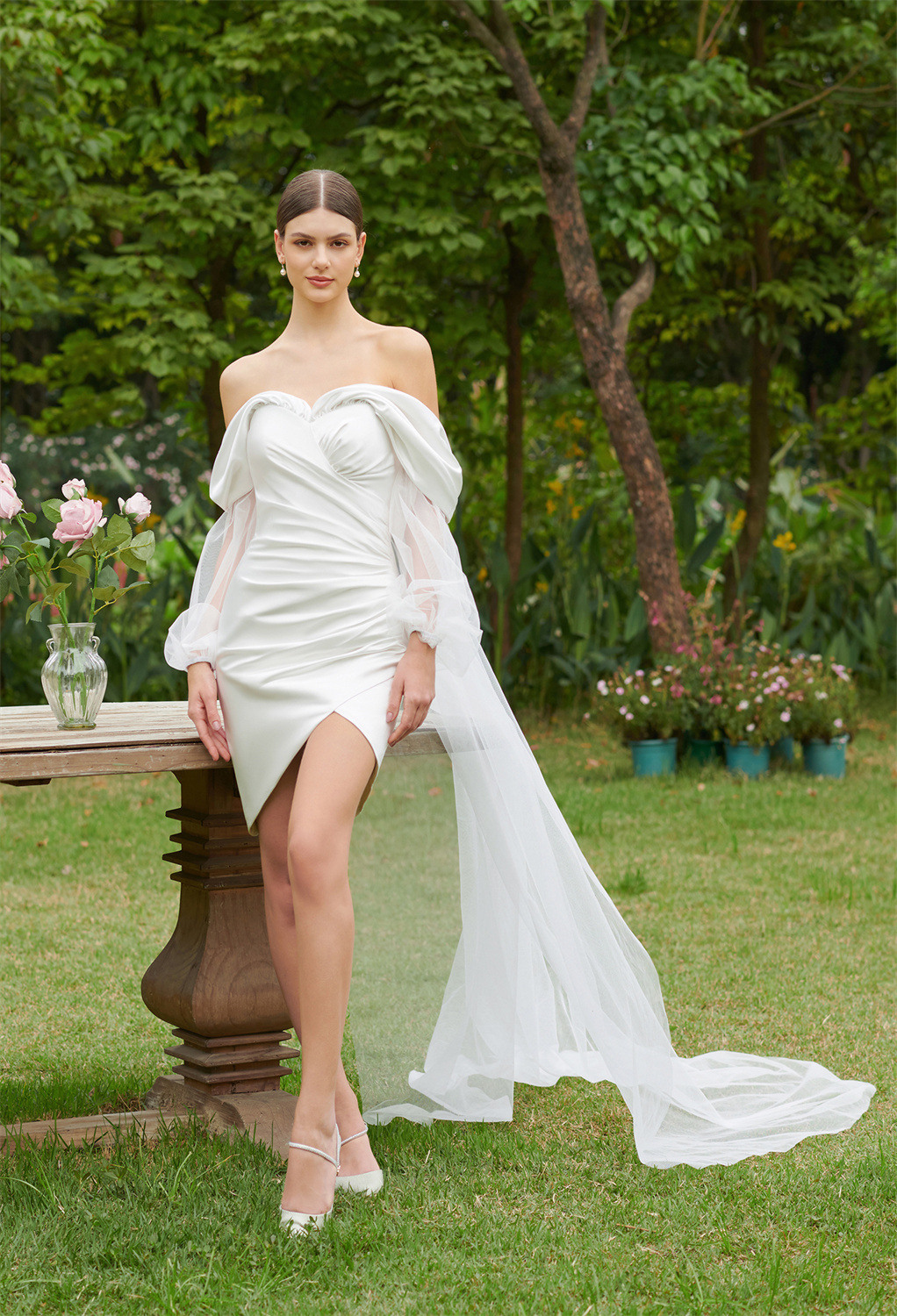 it features a sweetheart neckline with an endearing draped