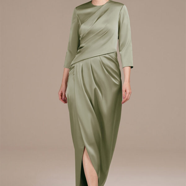 adorned with tasteful pleats for added elegance. The jewel neckline and versatile 3/4 sleeves exude sophistication