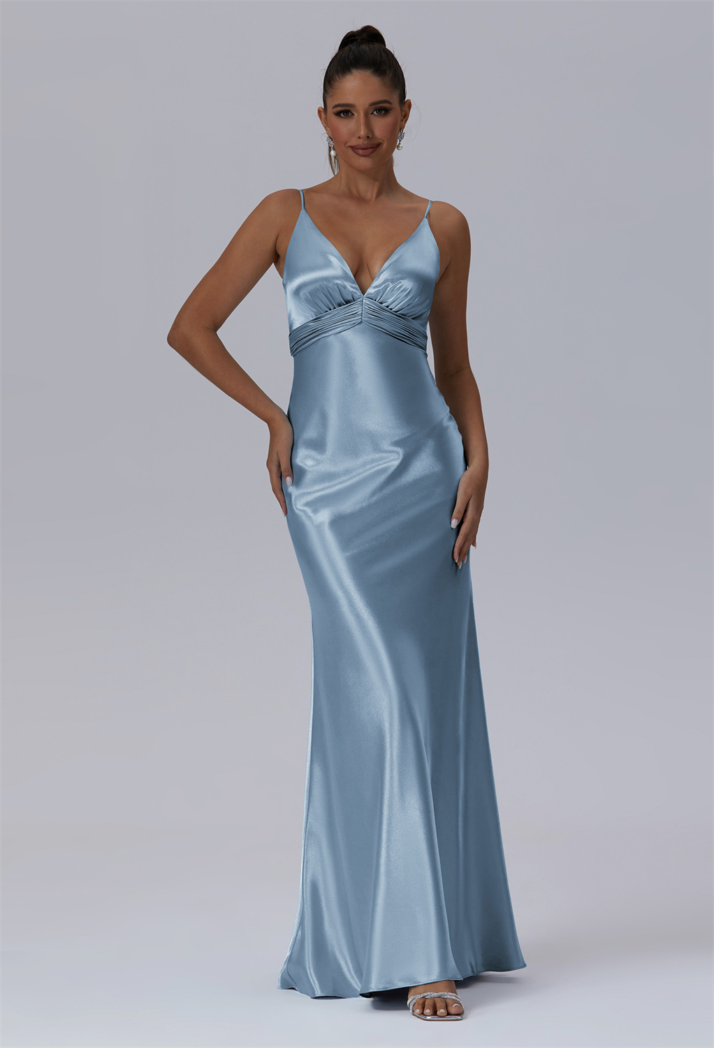 showcasing delicate spaghetti straps and a flattering V-neckline. Its high-waist design gracefully transitions into a mermaid silhouette