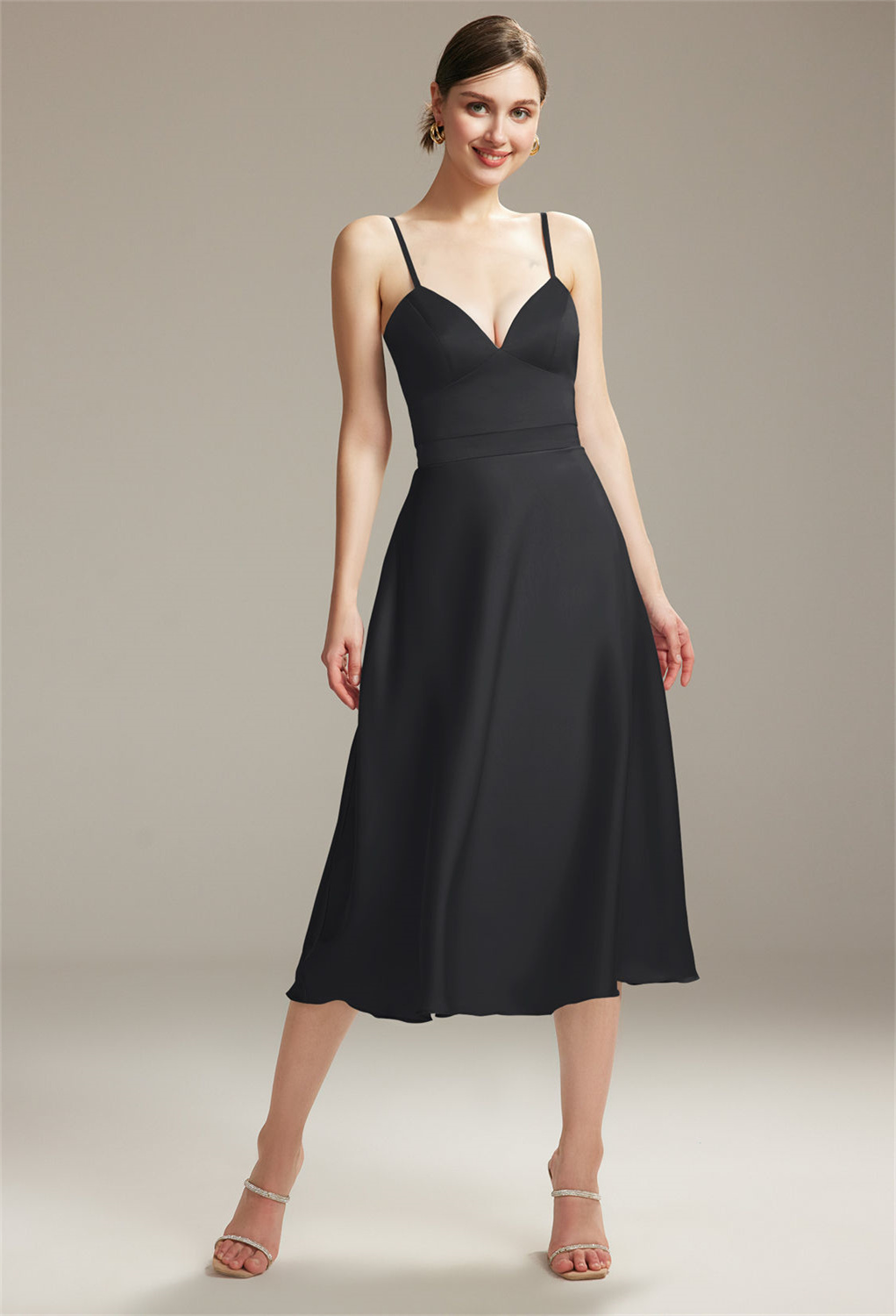 this tea length a-line satin charmeuse dress captivates with its sweetheart neckline and versatile sleeveless design
