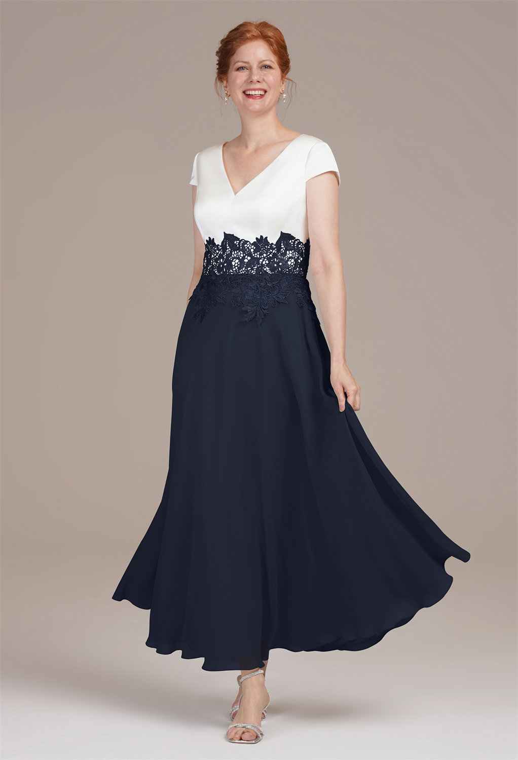 enhanced by lace detailing. The V-neck bodice