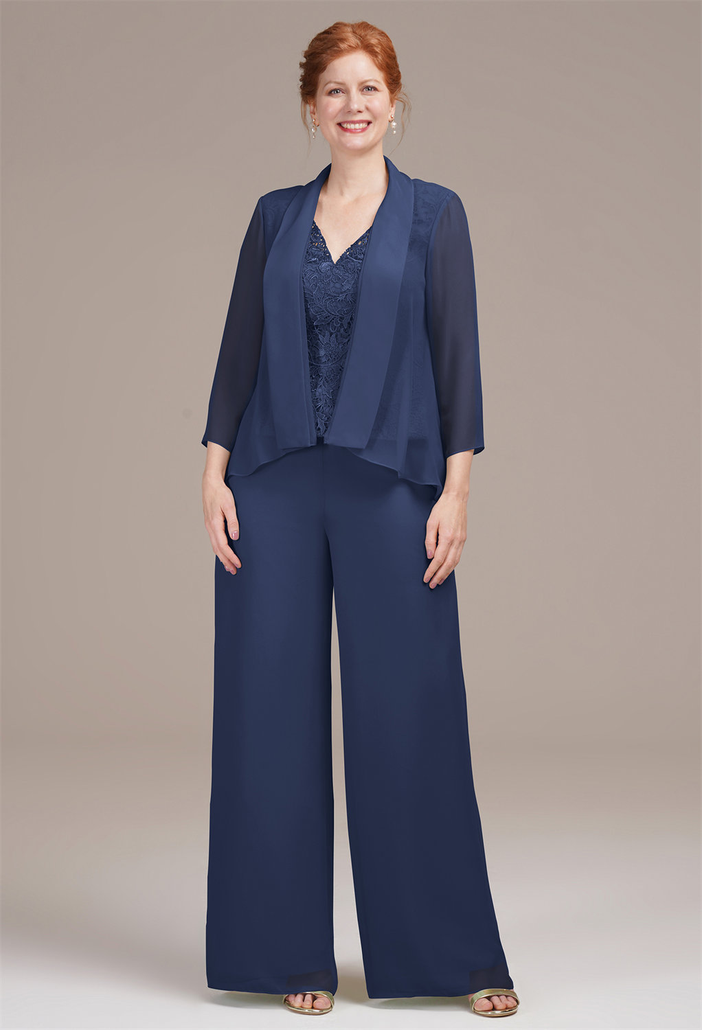 complemented by a sheer chiffon coat with long sleeves. The ensemble balances modern lines with classic elegance