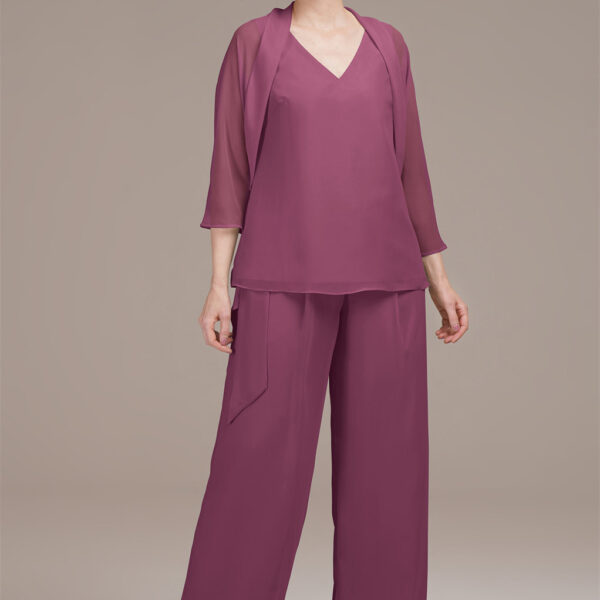creating a sophisticated silhouette. The wide-leg pants have elongating lines that visually extend the leg length