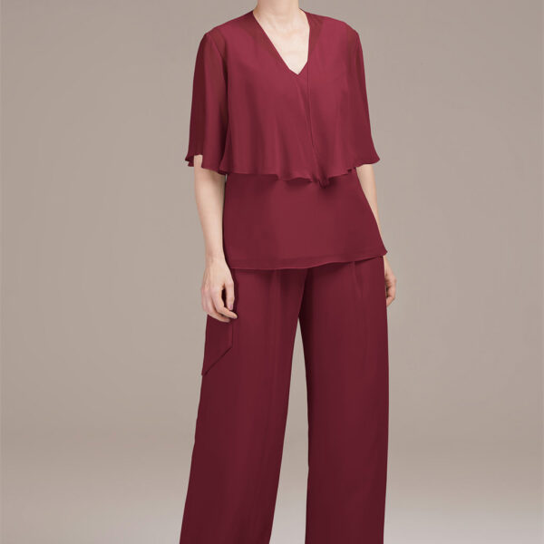 sleeveless V-neck top with a fluttering butterfly sleeve shawl for an air of playful elegance. The wide-leg pants gracefully flow to the floor