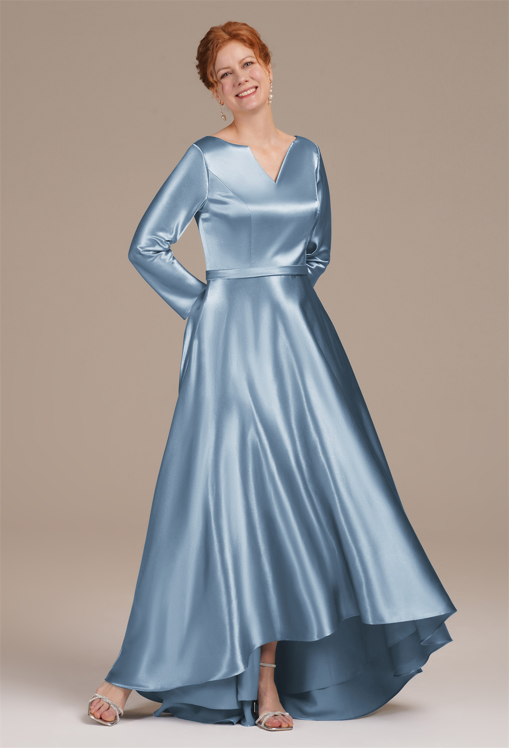 where the trendy hi-lo hemline sways elegantly with your movements. The refined V-neck and long sleeves create a silhouette of grace and poise