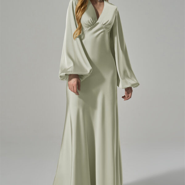 this dress combines classic sophistication with modern elegance. The subtle gathering at the bust enhances the feminine silh