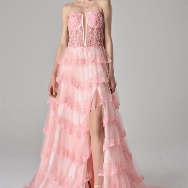 creating a voluminous and ethereal look. A daring front slit adds a touch of allure and