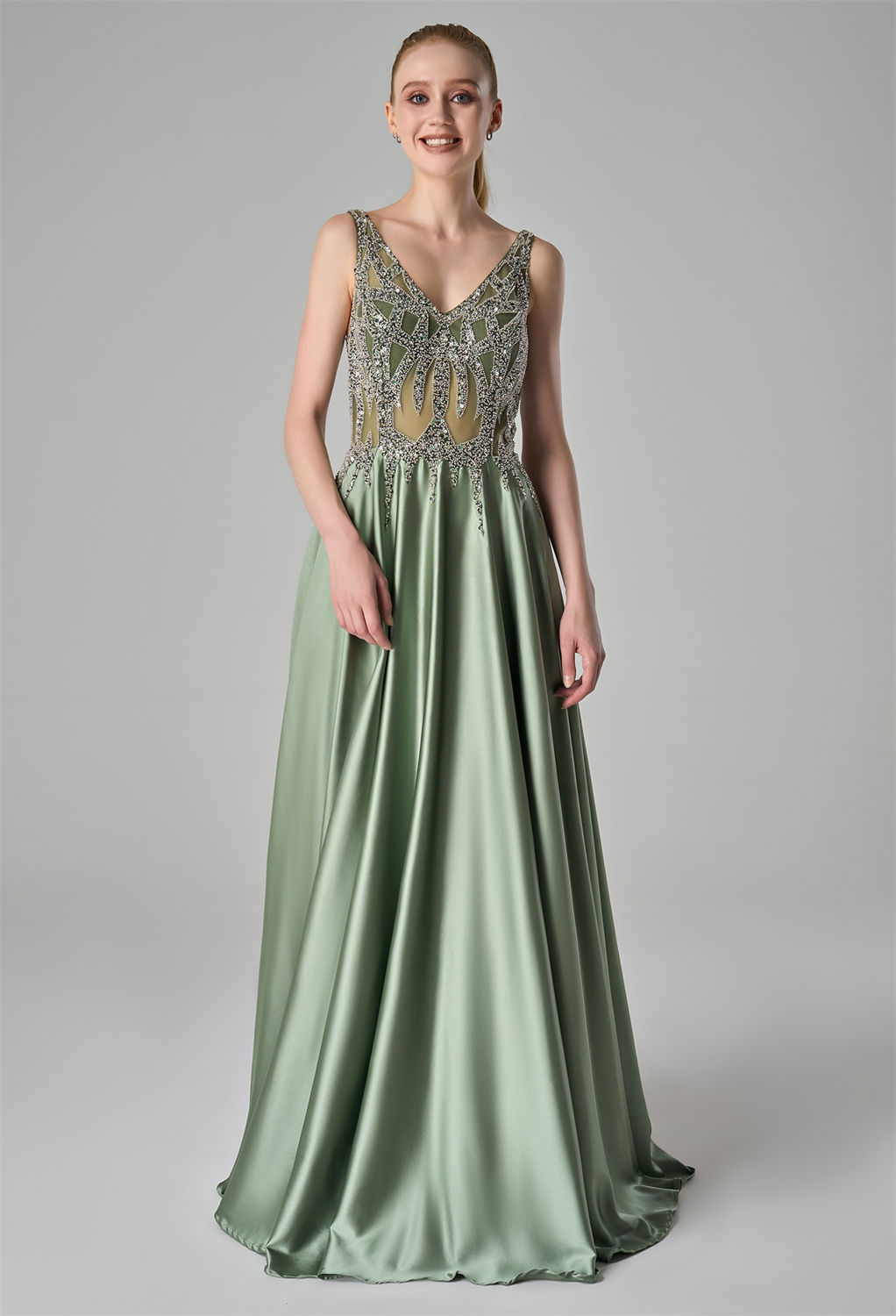 V-neck bodice embellished with intricate beadwork. The elegant satin skirt flows gracefully from the waist