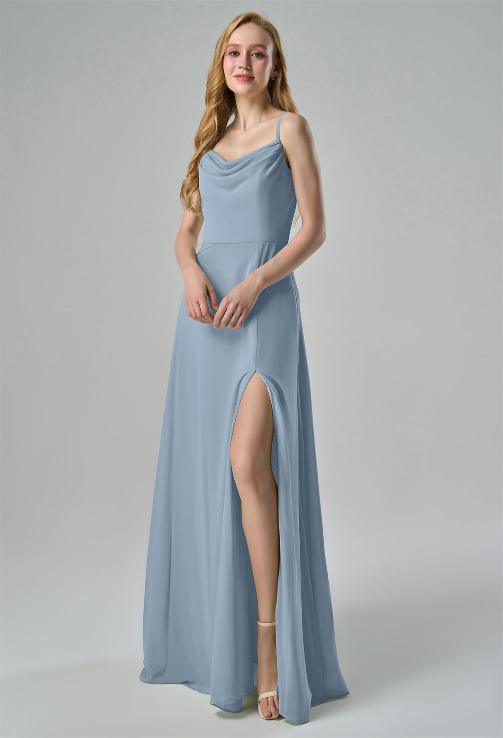 offering a timeless and sophisticated look. The fitted bodice flows into a long