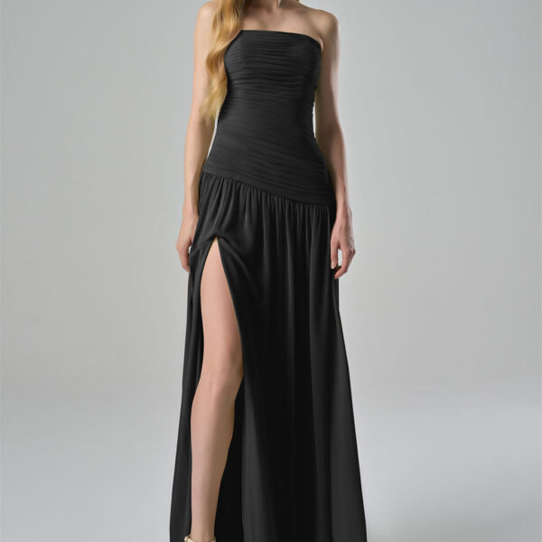 ruched bodice that elegantly accentuates the waist. The flowing skirt is designed with a high slit